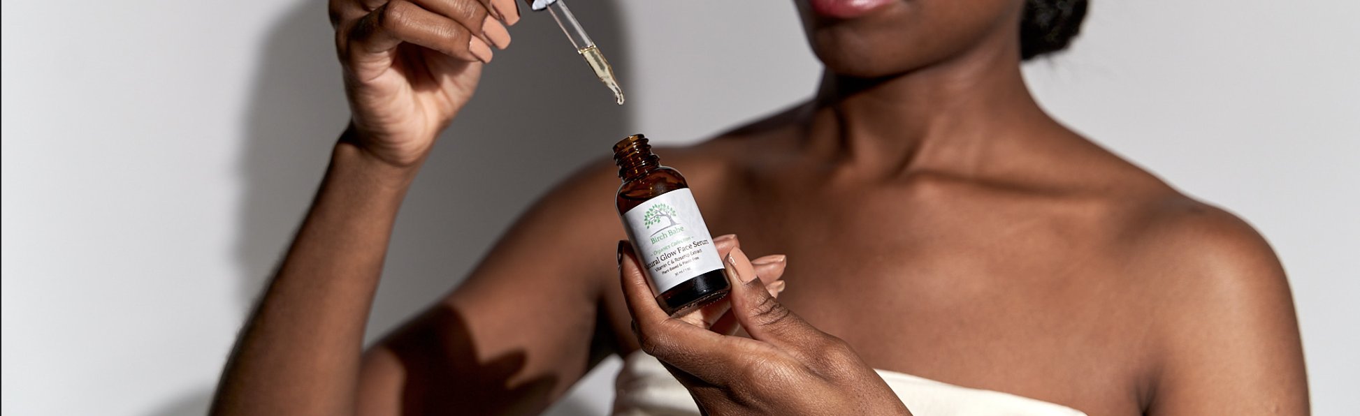 Birch Babe all natural glow face serum on a beach in Tofino on Vancouver Island